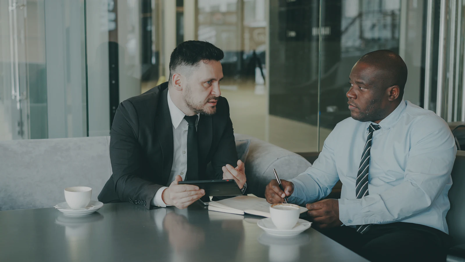 A career coach in a one-to-one conversation with a professional